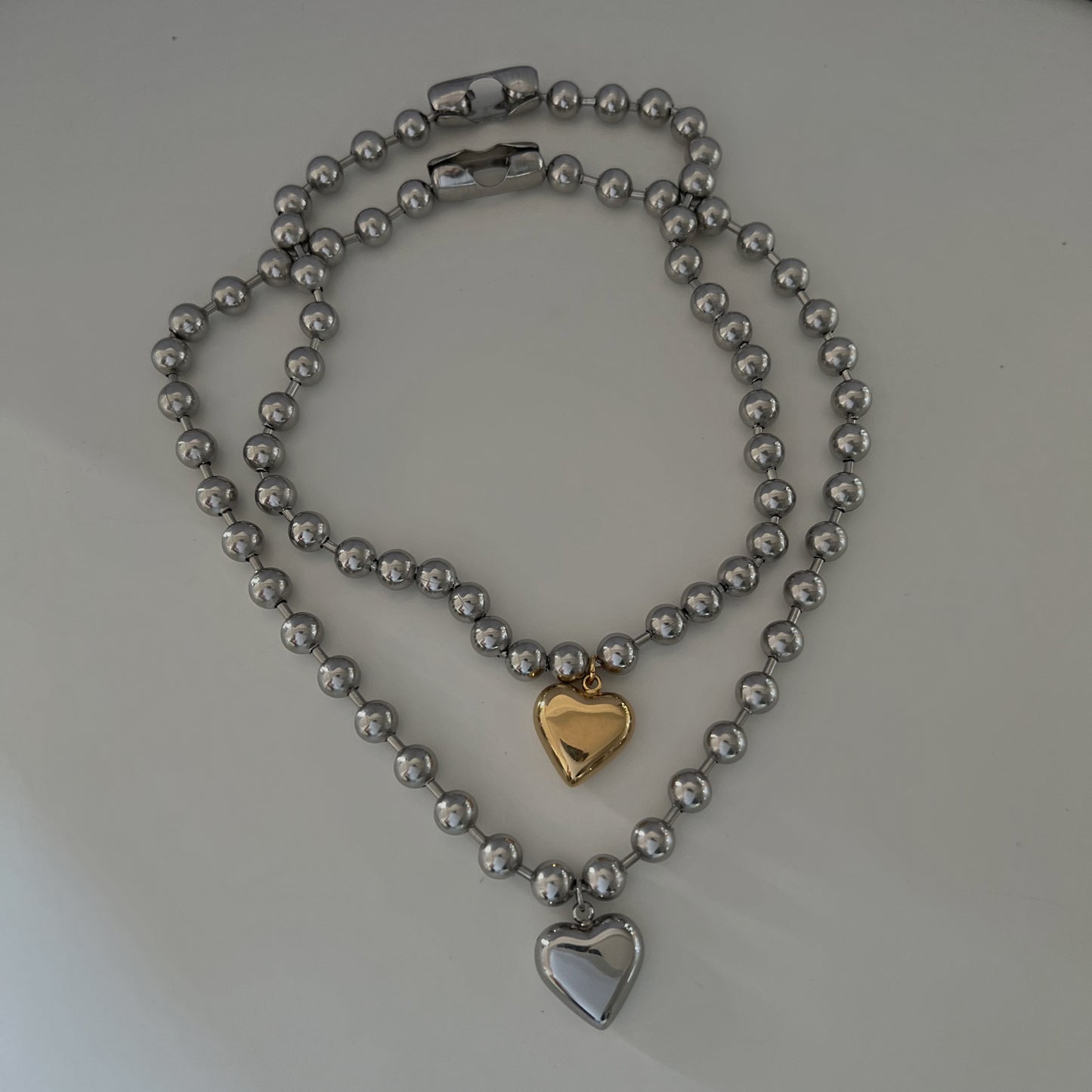 CHAINED HEARTS NECKLACE